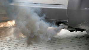 car emitting hazardous pollutants to atmoshphere